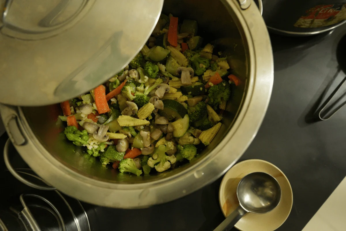 Nutritious sattvic yogic steamed vegetables served at Aatm Yogashala dining in Rishikesh