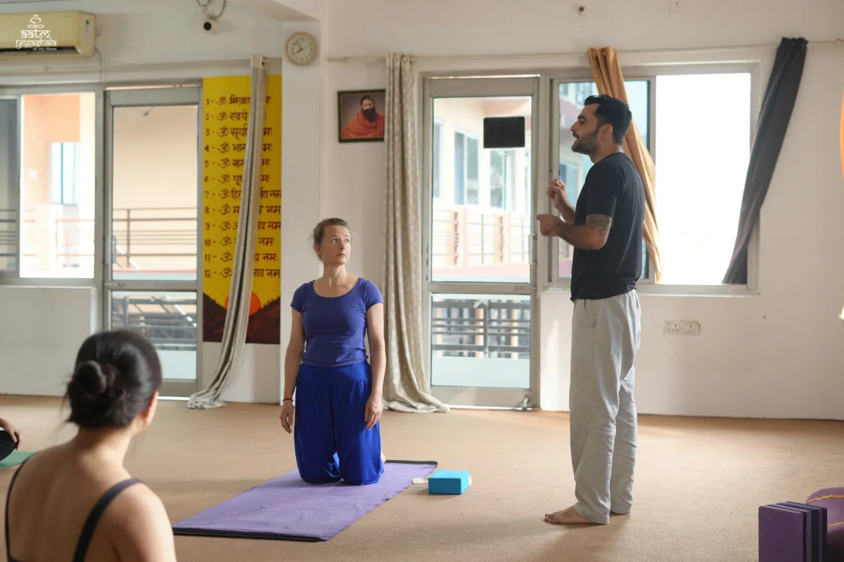 Lead teacher Yogi Amit Deshwal conducting hands-on asana alignment and adjustment session in 300 Hour Yoga Teacher Training Rishikesh
