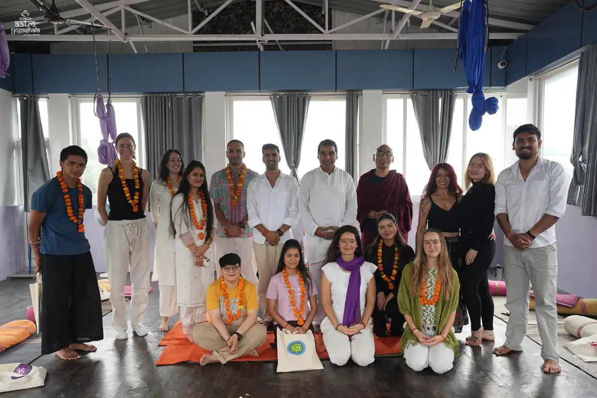 300 Hour Yoga Teacher Training international student batch and teachers during opening ceremony with marigold garlands at Aatm Yogashala Rishikesh