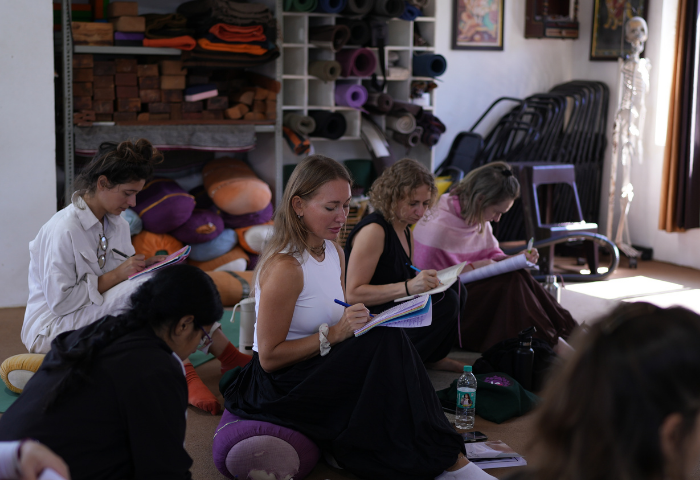 International Ayurveda students attending wellness and therapy learning class in Rishikesh India