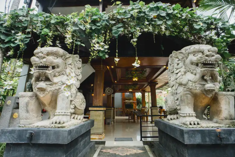 traditional Balinese stone lion statues at Aatm Yogashala Bali entrance
