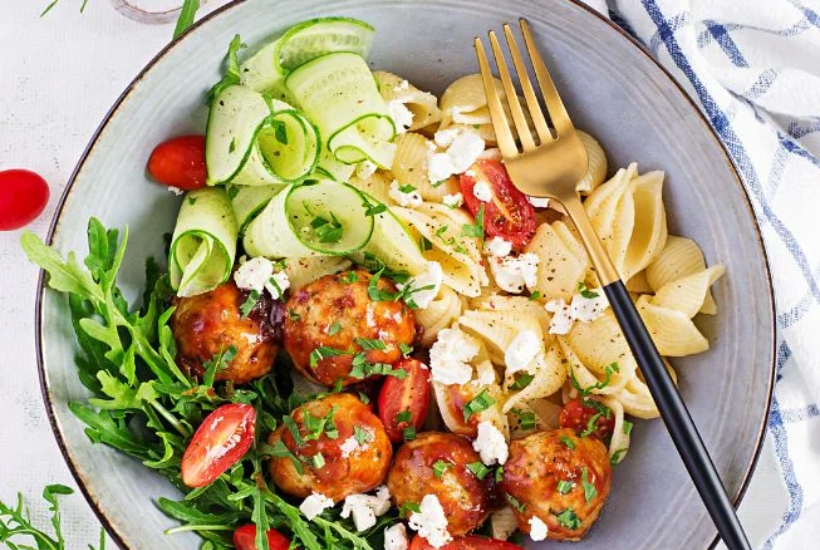 fresh salad and pasta bowl meal at Aatm Yogashala Bali yoga retreat