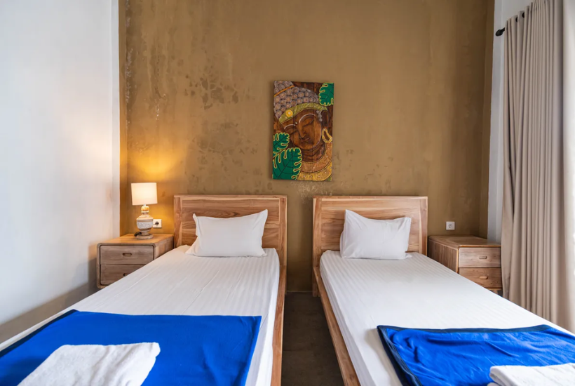 twin room with two single beds at Aatm Yogashala Bali TTC