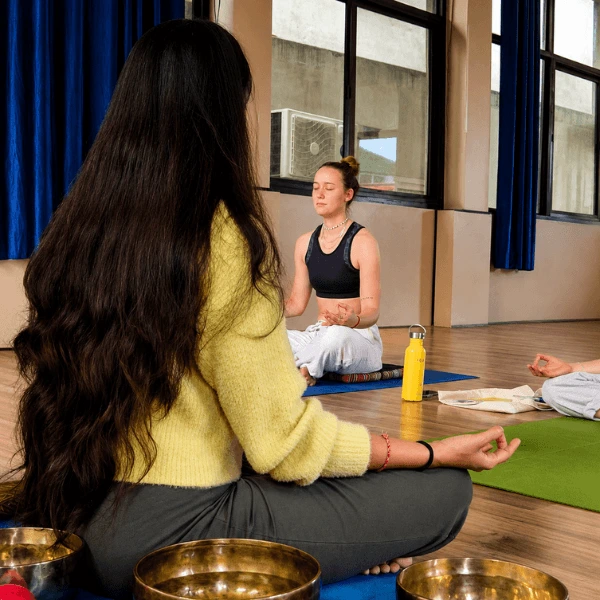 Group sound meditation session during sound healing teacher training in Rishikesh India