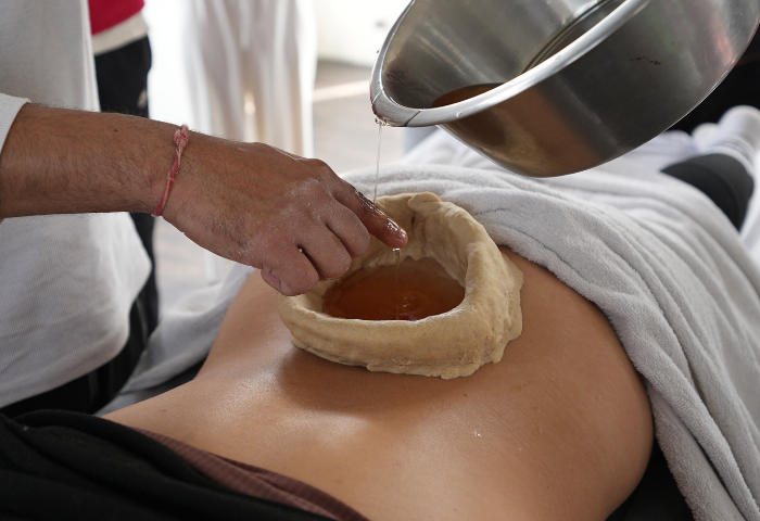 Traditional Kati Basti herbal oil therapy treatment for back pain in Rishikesh India