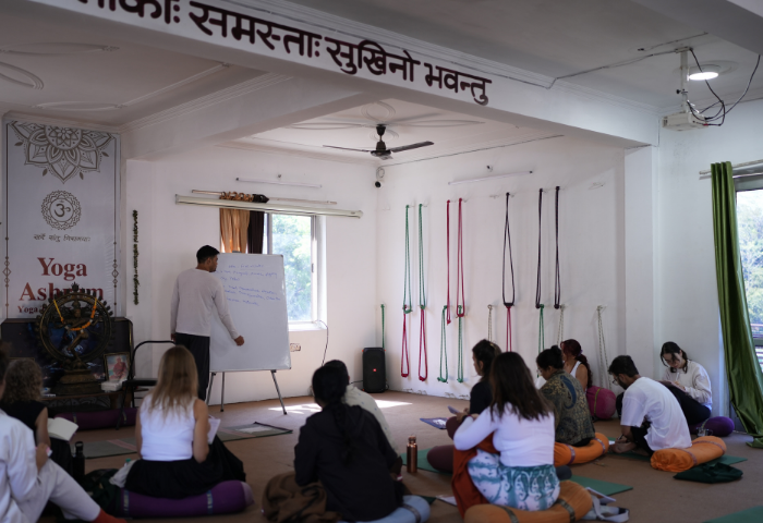 Traditional yoga ashram Ayurveda training classroom session in Rishikesh India